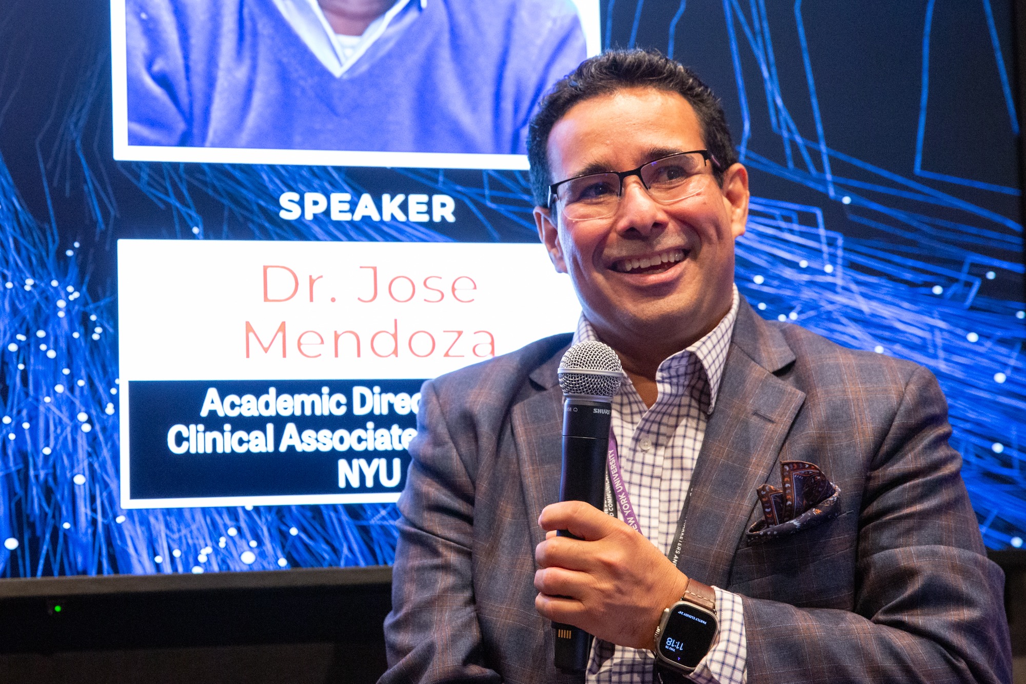 Dr. Jose Mendoza speaking at an event